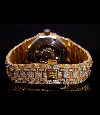 Luxury 18K Yellow Gold Plated iced-out watch featuring D Color VVS Moissanite stones, champagne diamond-paved dial, and available with Japanese Automatic, Semi ETA Automatic, or ETA Automatic movement.